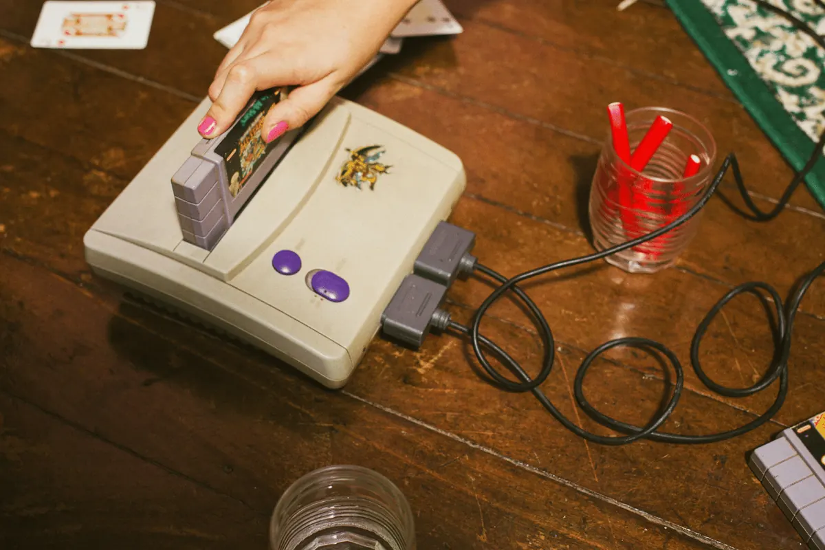 A Super Nintendo console and controller on a table